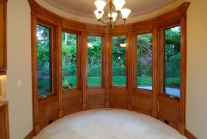An expansive wooden bow window.